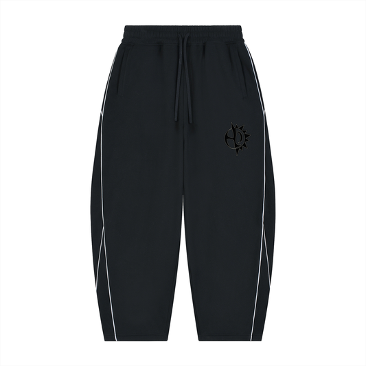 The Golden Hour Sweatpants - black barrel-leg sweatpants with white side piping, front view